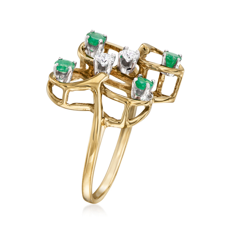 Gold swirl ring with four oval green emeralds and round diamond accents, side view