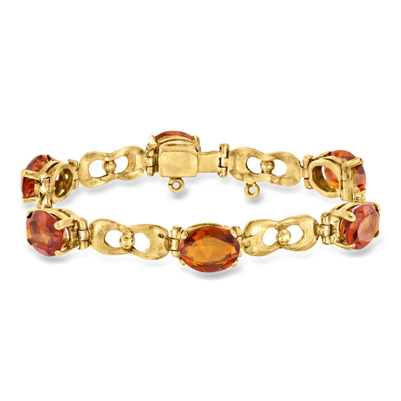 18kt yellow gold link bracelet with oval citrine stones, hinged clasp and safety chain
