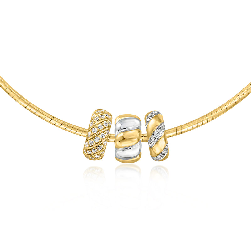 Ribbed silver-and-gold charm bead with textured gold side beads on gold chain