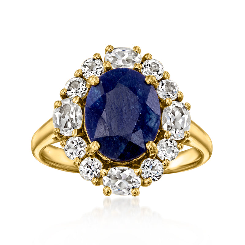 Oval sapphire-style gemstone ring in gold with white crystal halo accents