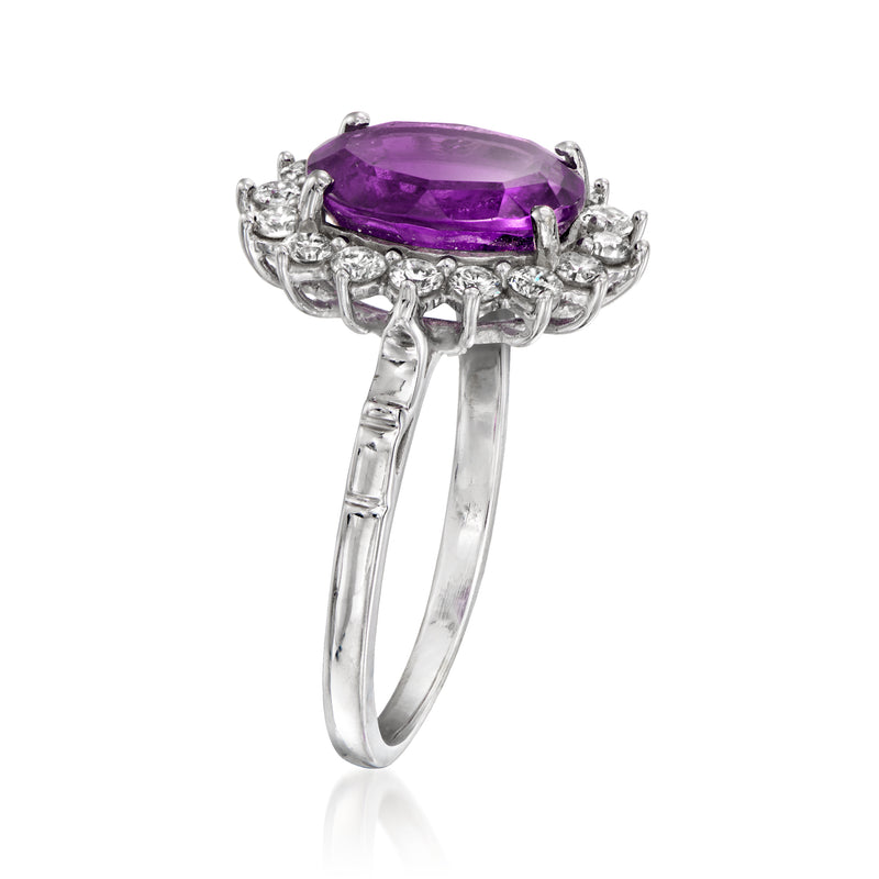 White gold ring with raised purple amethyst oval center and side diamond rows