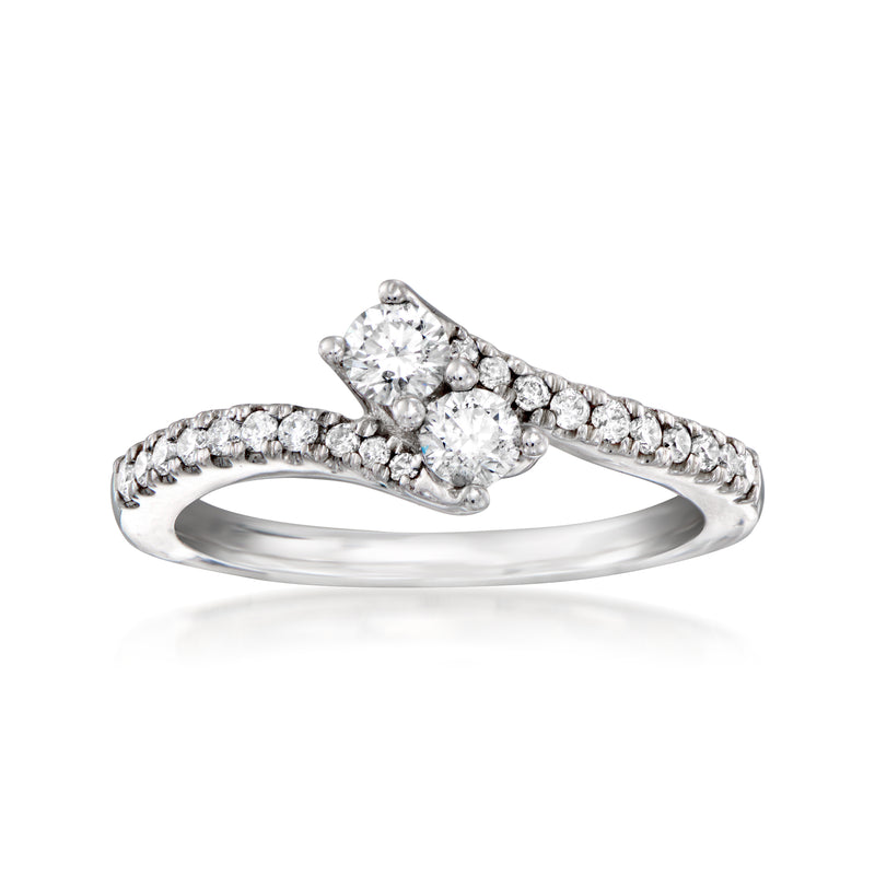 Diamond bypass ring in 14kt white gold with round center stones and pavé band