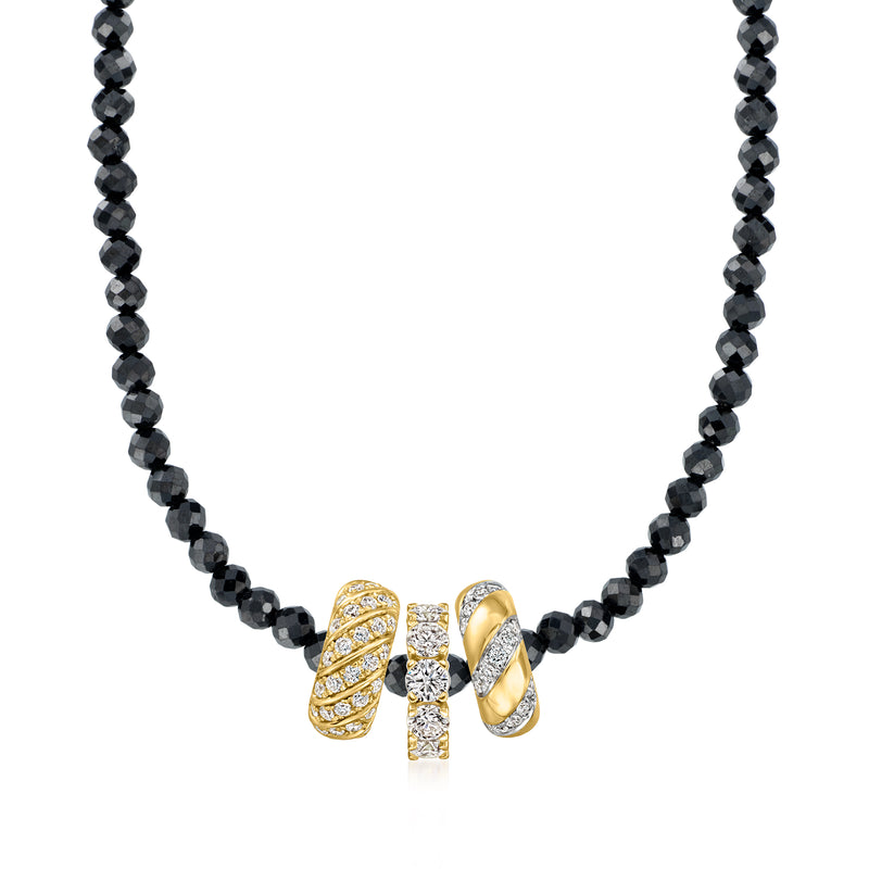 Black beaded necklace with a gold diamond bead charm showing three round stones
