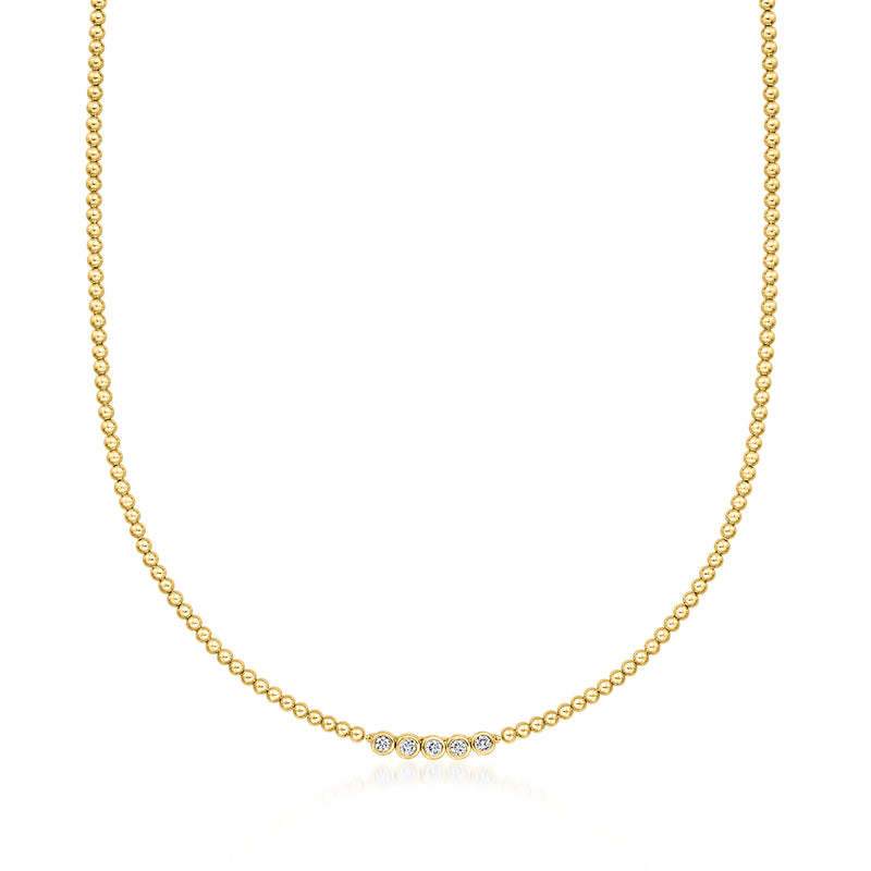 Gold beaded necklace with bezel-set round diamond accents
