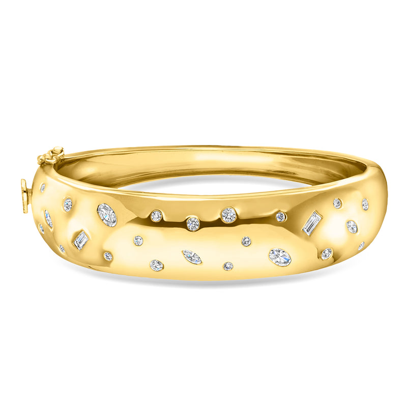 Gold bangle bracelet with scattered round white diamonds