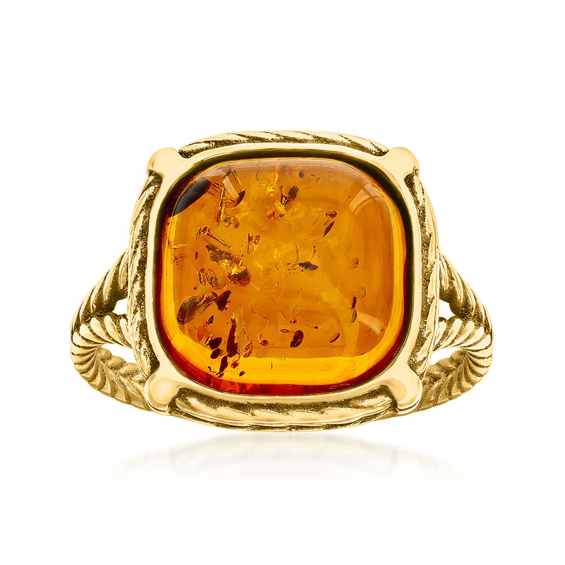 Amber ring with oval orange amber cabochon bezel, ornate gold rope shoulders