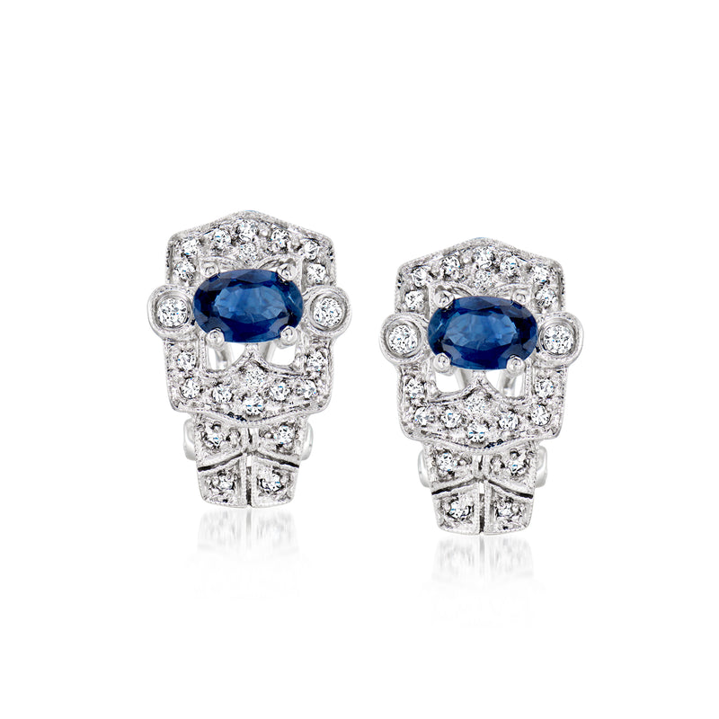 Vintage 14kt white gold sapphire and diamond stud earrings with blue oval center