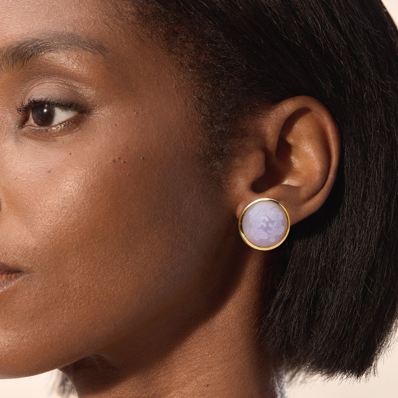 Lavender jade cabochon stud earrings with 14kt yellow gold bezel on ear