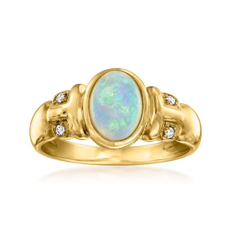 Vintage opal and diamond ring in 14kt yellow gold, oval opal center with side stones