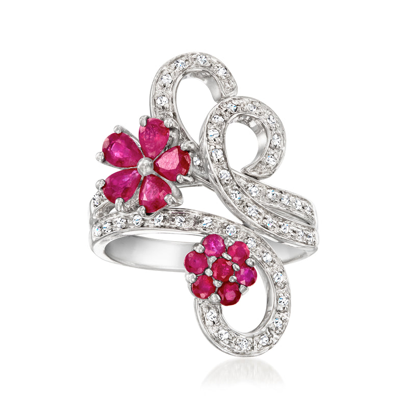 14kt white gold ring with ruby flower clusters and diamond swirl accents, prong-set