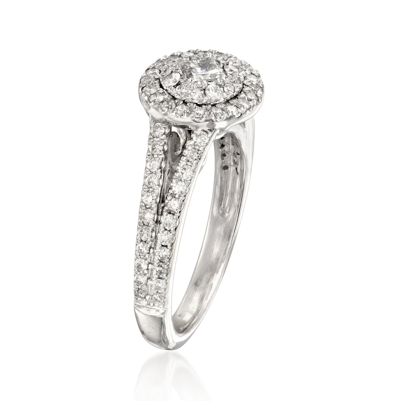 Vintage diamond ring in 14kt white gold with halo cluster and pavé split shank