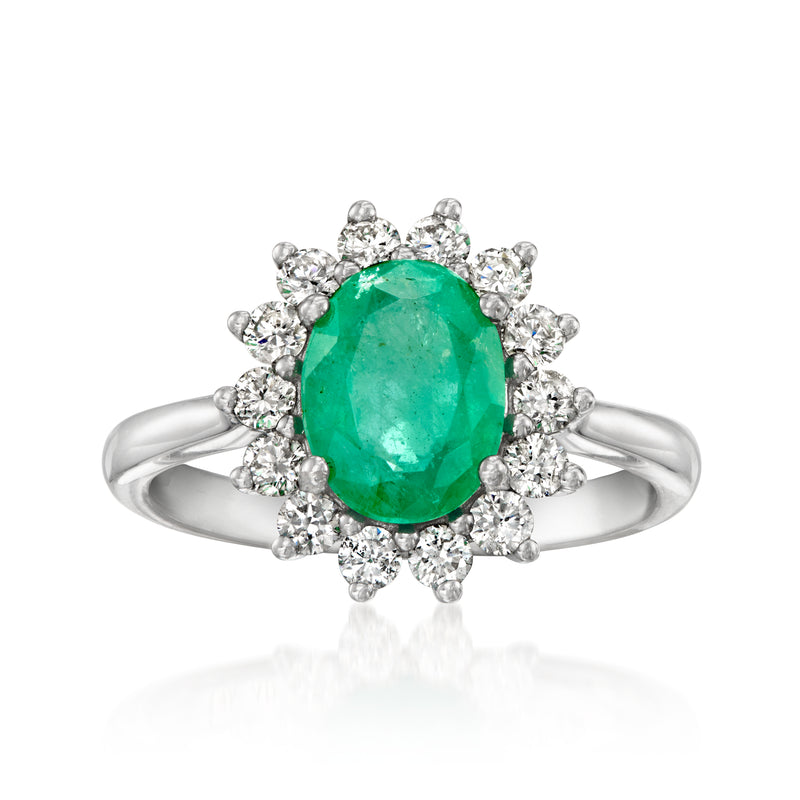 14kt white gold ring with oval green emerald-cut center and diamond halo