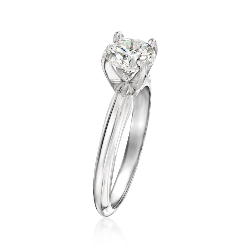 14kt white gold solitaire diamond ring, round diamond in four-prong setting, side view