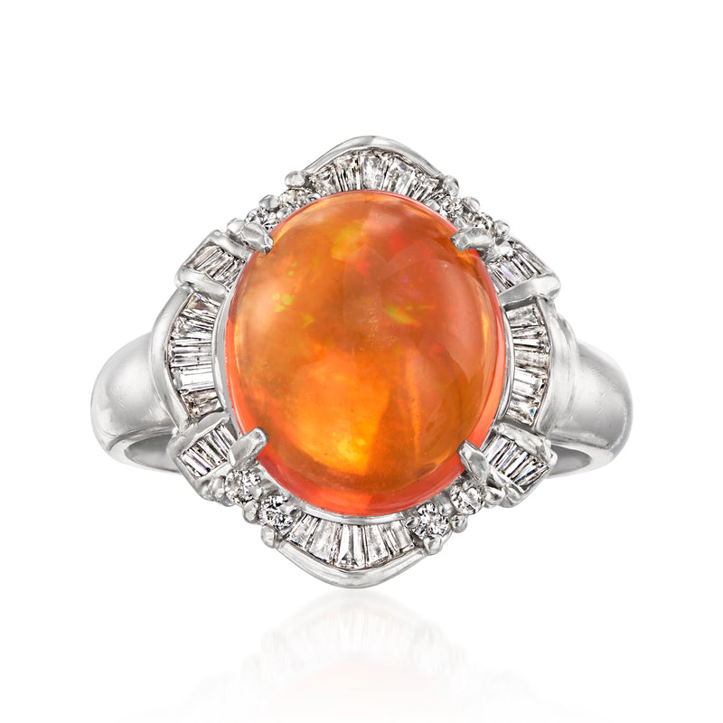 Platinum ring with oval orange opal center and diamond baguette halo