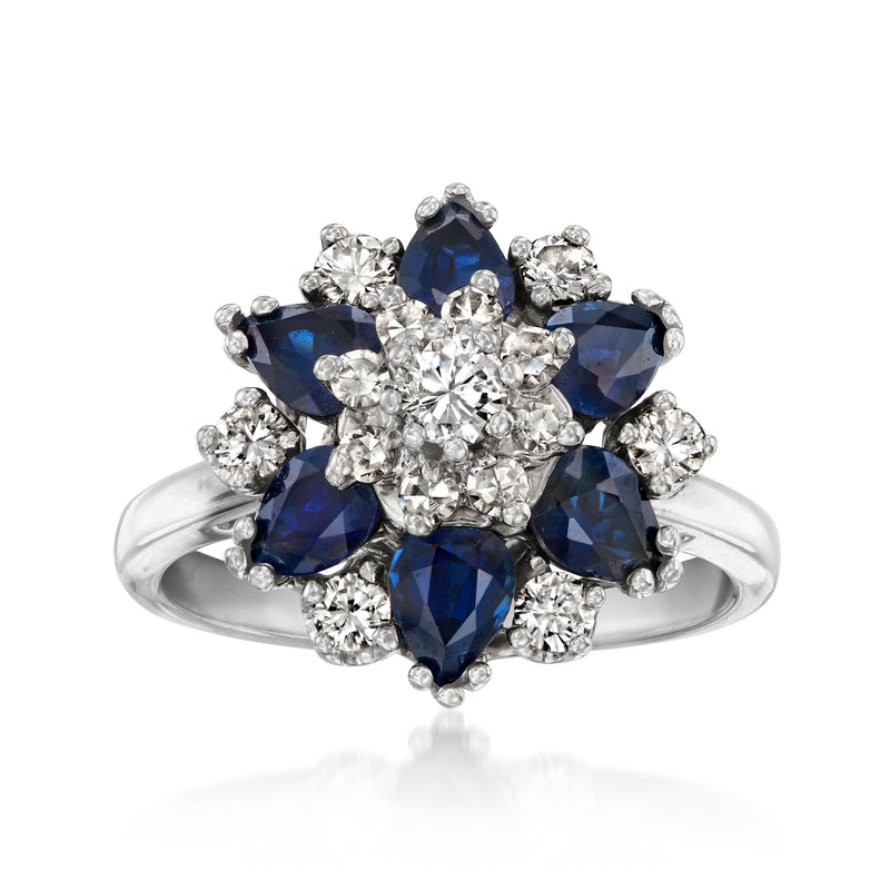 Vintage flower ring in white gold with blue sapphire and diamond cluster, round stones