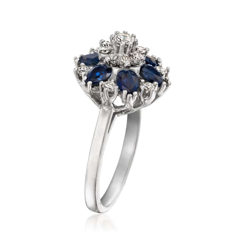 White gold vintage flower ring with blue sapphires and diamonds, raised side view