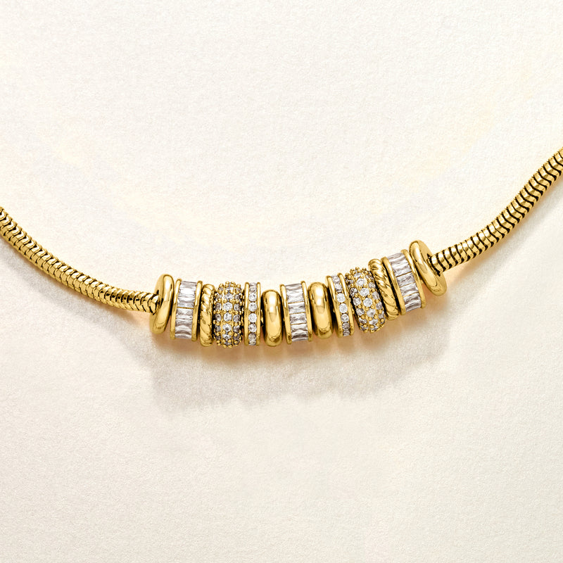 Yellow gold-plated bead charm necklace with CZ-accented barrel beads