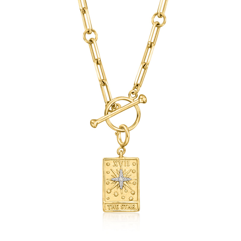 Gold chain necklace with tarot card charm, starburst design, and “THE STAR”