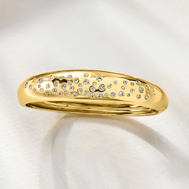 Yellow gold-plated bangle bracelet, side view with clear CZs set in a band