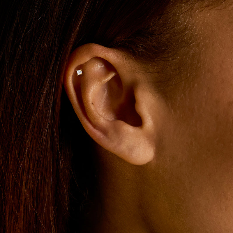 Princess-cut lab diamond stud earring in 14kt yellow gold on ear