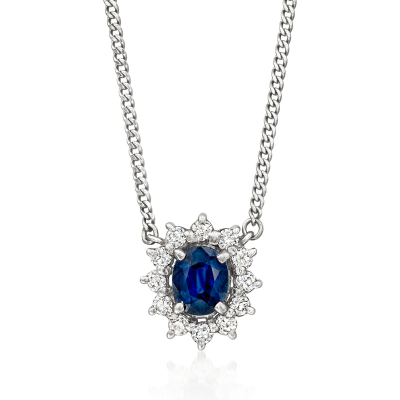 Vintage platinum sapphire and diamond necklace with oval blue center