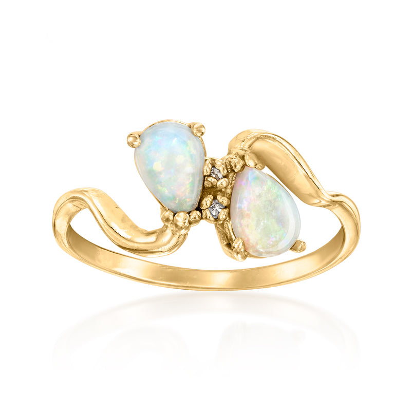 14kt yellow gold vintage ring with two prong-set teardrop opal stones