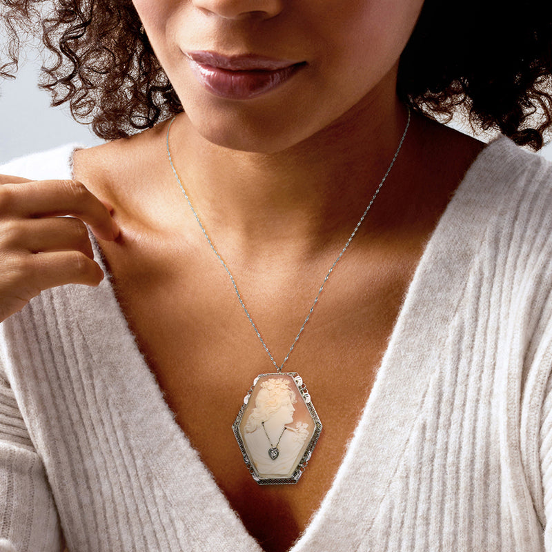 Brown shell cameo necklace pendant with ornate octagonal bezel and thin link chain