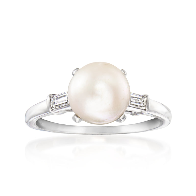 Platinum ring with large white cultured pearl center and baguette diamond accents