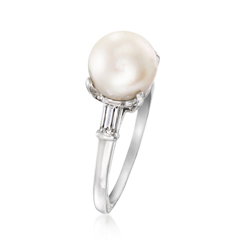 Platinum ring with white cultured pearl and four baguette diamond side settings