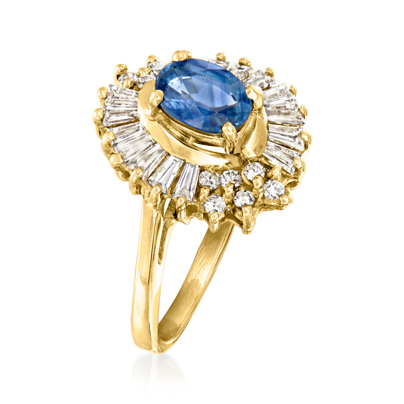 Blue oval sapphire with baguette and round diamond halo on yellow gold ring, side view