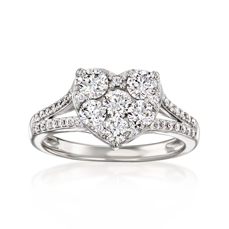 Heart-shaped diamond ring in 14kt white gold with pave band and round diamond center