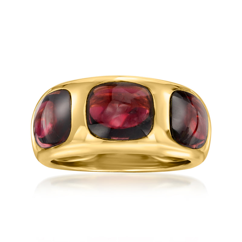 Yellow gold ring with rectangular rhodolite garnet center and two round side cabochons