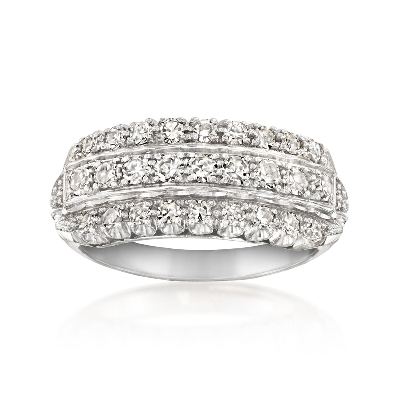 Three-row diamond band ring in white gold, domed top with prong-set stones.