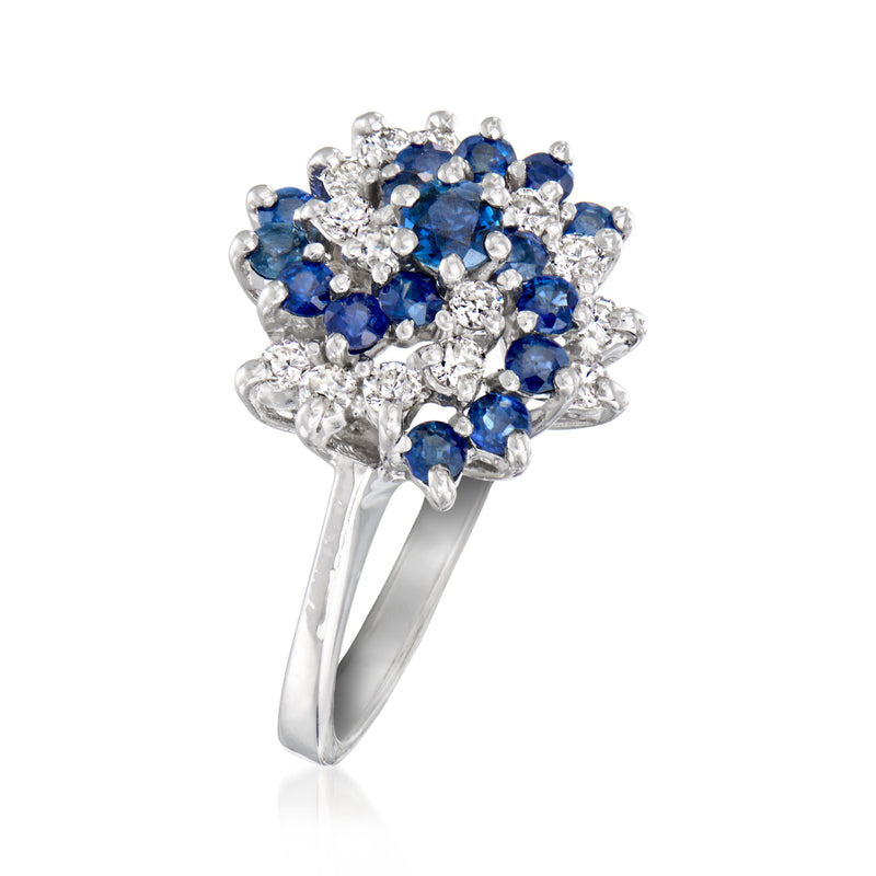 Sapphire and diamond swirl cluster ring in white gold, round blue stones with sparkle