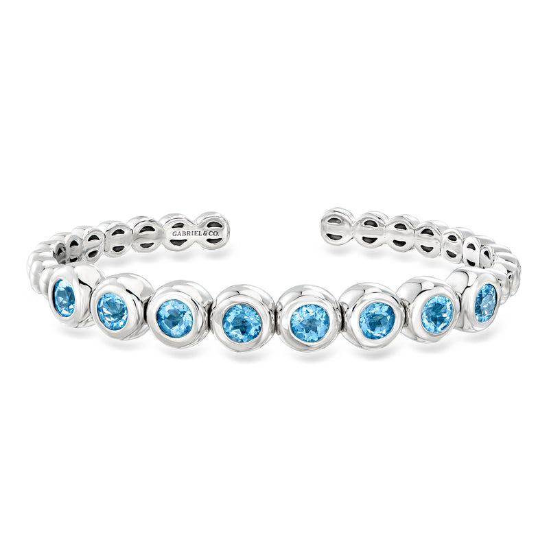 Sterling silver cuff bracelet with round Swiss blue topaz stones