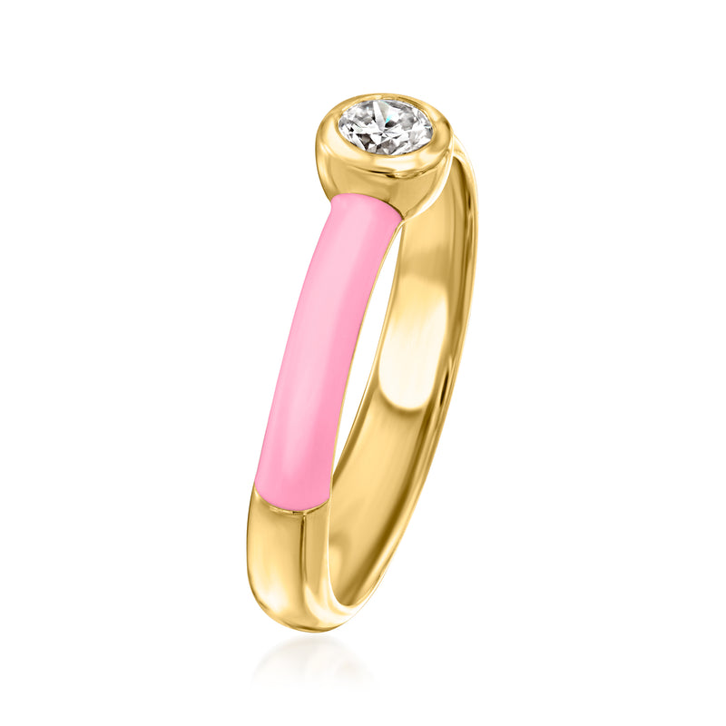 Gold bezel-set diamond ring with pink enamel band, angled side view