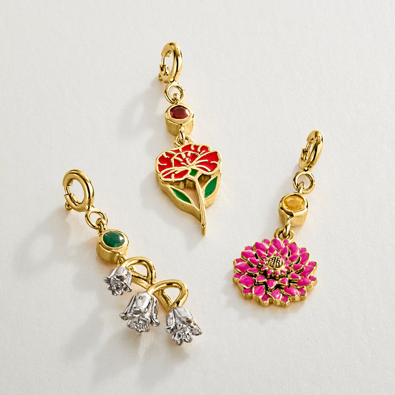 Gold-tone birthstone flower charms with red, green, pink enamel and small crystal accents