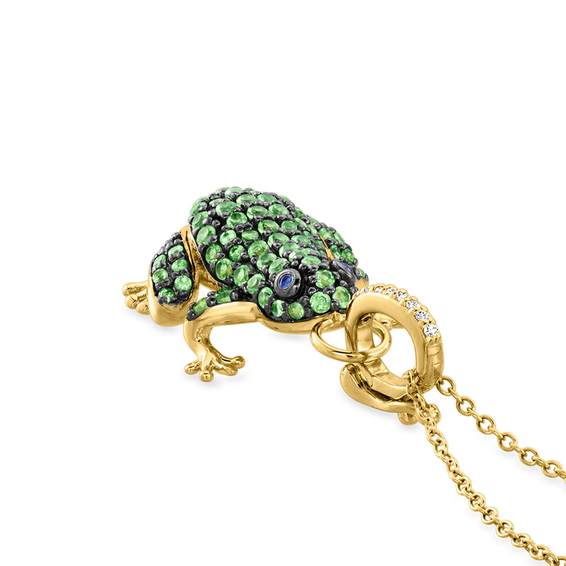 Side view frog pendant with green stones, blue eye, and diamond-set gold bail