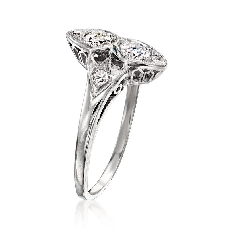 Platinum diamond ring with marquise and round stones, high setting