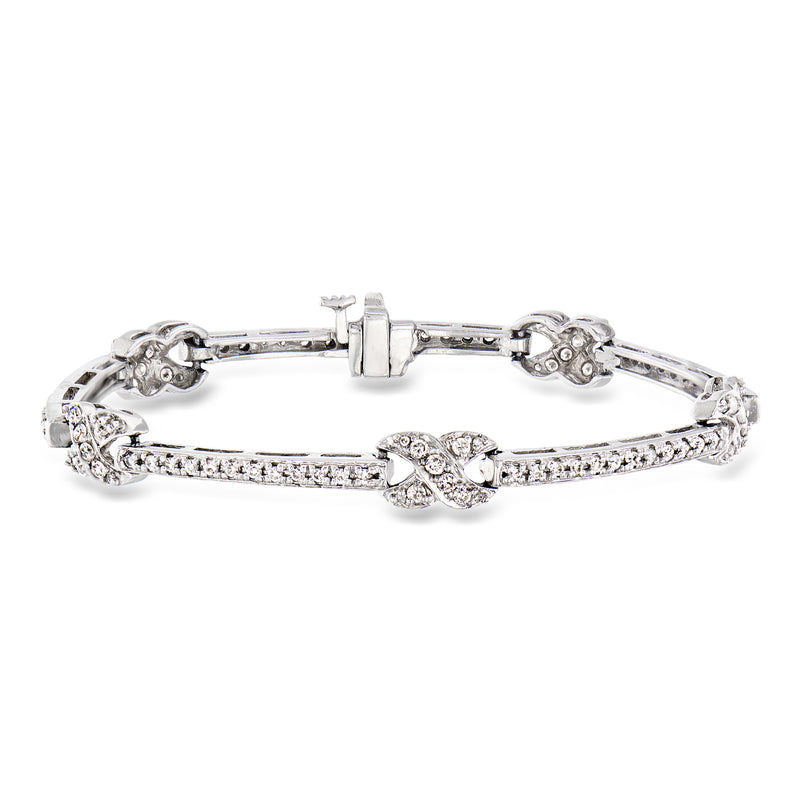 Vintage diamond bracelet in 14kt white gold with floral link accents
