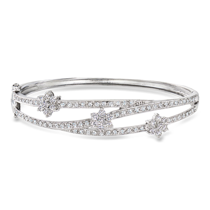 Vintage white gold flower bangle bracelet with three pavé floral accents