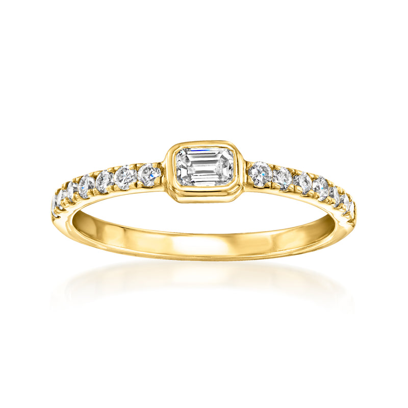 Gold-tone ring with emerald-cut center and round lab diamond side stones