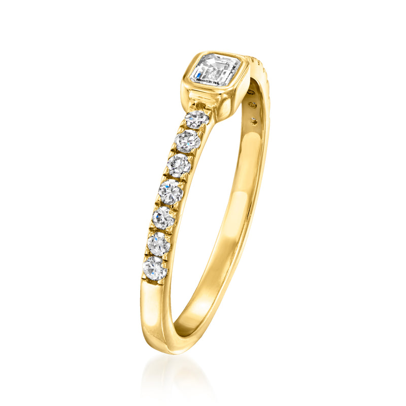 Gold-tone ring side view with row of round lab diamonds and emerald-cut top