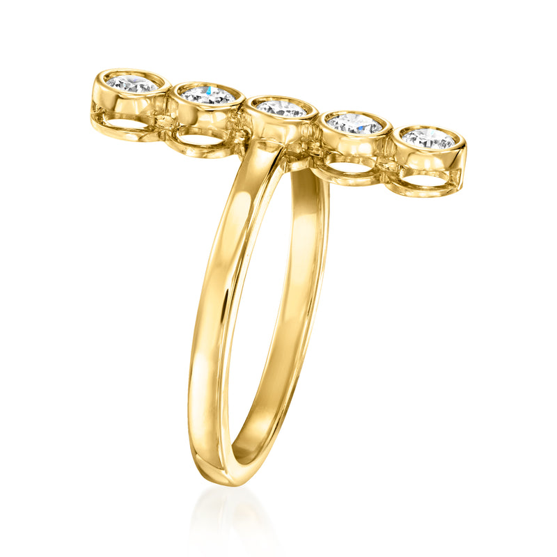 Gold ring with side view of round bezel-set stones across open split band