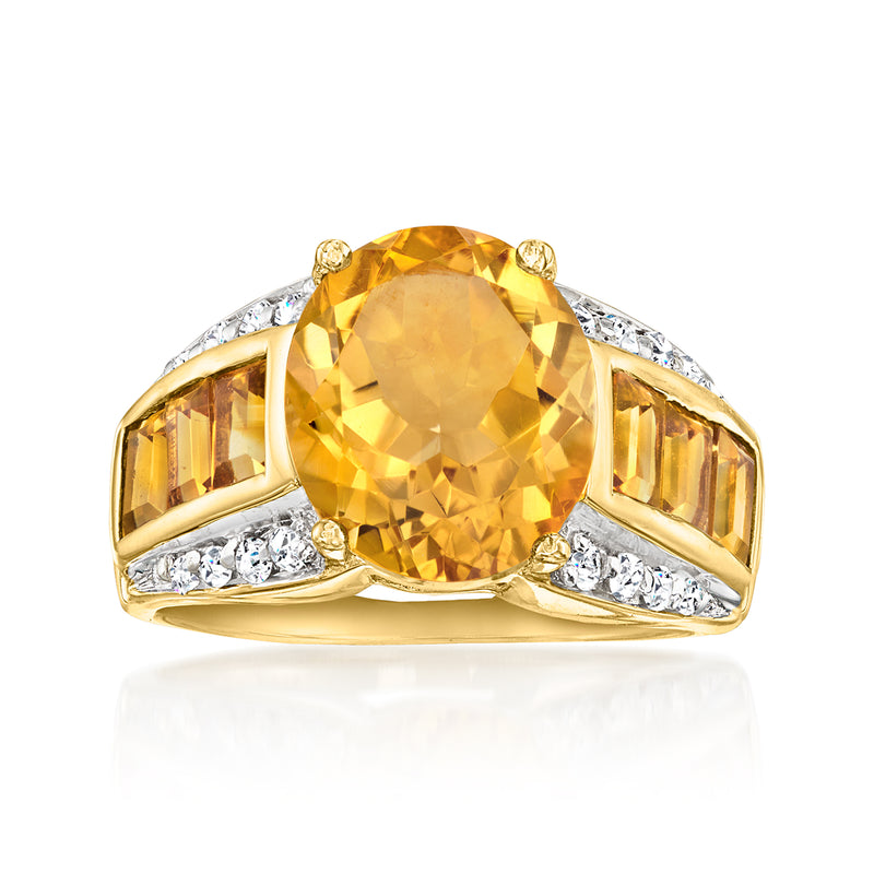 Yellow gold vintage ring with round citrine center and diamond side accents.