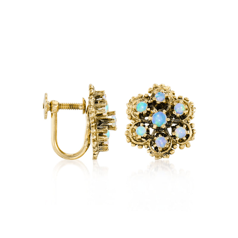 Yellow gold clip-on earring with ornate flower setting and blue opal stones