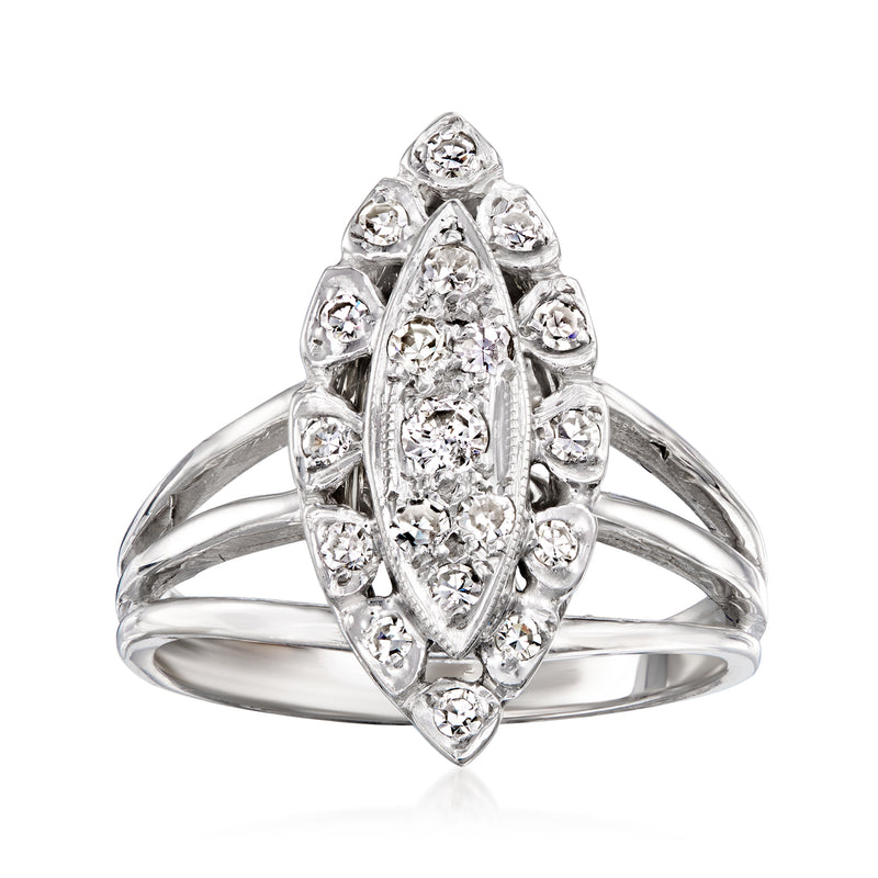 Vintage navette diamond ring in 14kt white gold, oval center with side stones