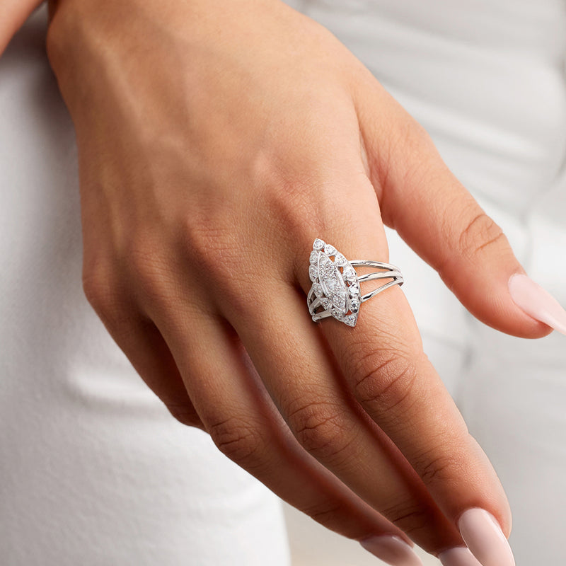 14kt white gold navette diamond ring on hand, marquise center with halo