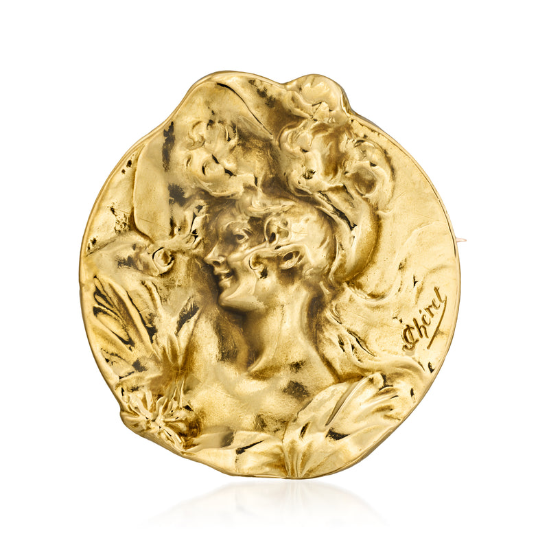 Yellow gold vintage portrait pin with detailed floral figure relief