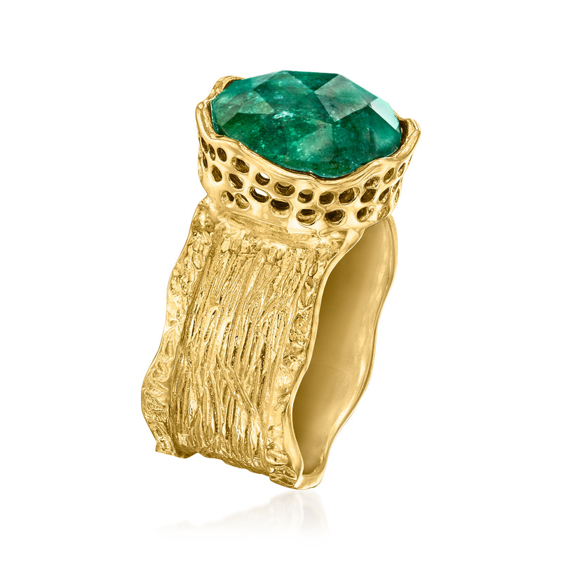 Wide gold ring with textured shank and emerald-green oval stone, side view